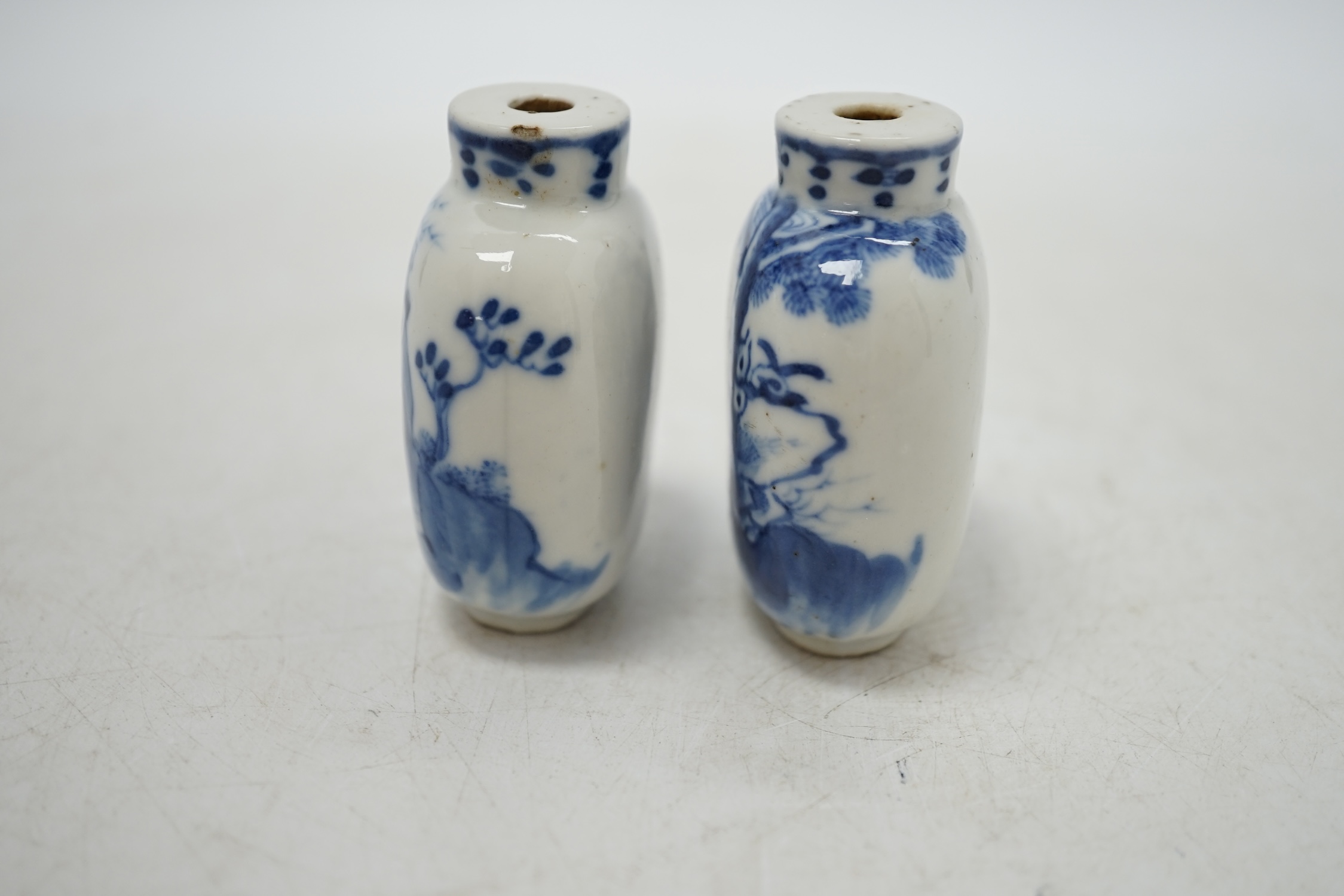 Two Chinese blue and white snuff bottles decorated with figures, largest 6cm high. Condition - fair
